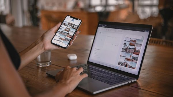 pexels-photo-4549414-4549414 Woman edits social media content on phone and laptop at a cafe in Bali.